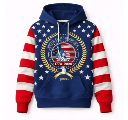 A navy blue hoodie featuring a patriotic USA 250th anniversary design with the Statue of Liberty, an American flag motif, and red-and-white striped sleeves.